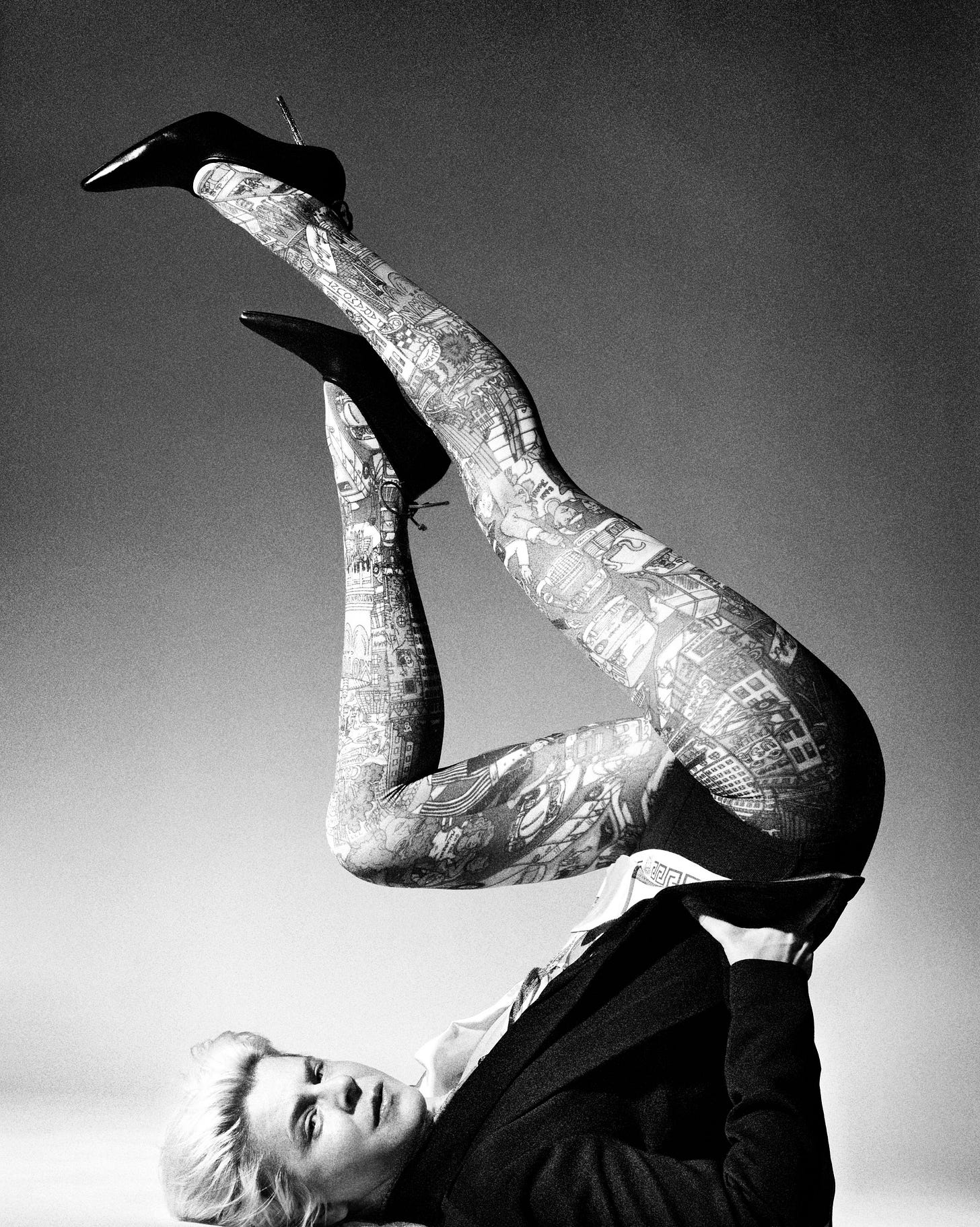 Image may contain Robyn Person Skin Tattoo Face Head Body Part Finger Hand Smoke Pipe Clothing Footwear and Shoe