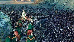 knights on horseback plowing through orcs during battle