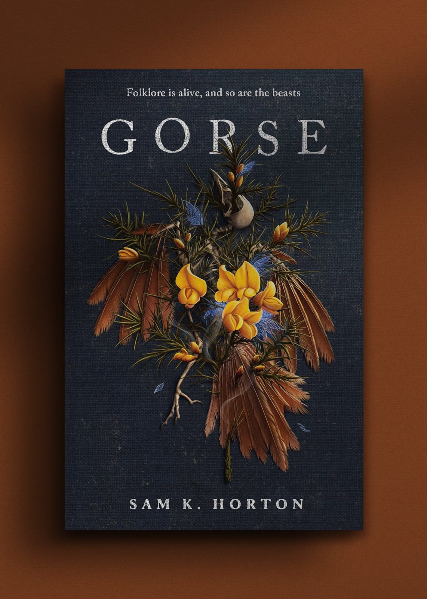 Cover features a bird's skeleton and feather bound with flowers.