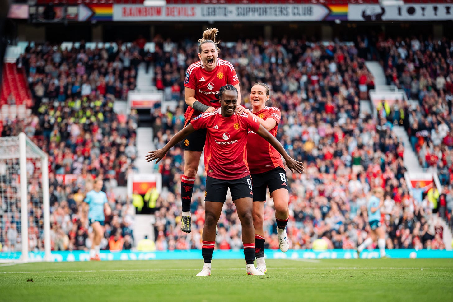 Melvine Malard celebrates her goal v Man City with Elisabeth Terland and Grace Clinton.