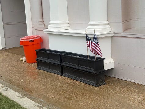 Fake stone columns end several inches above the ground.