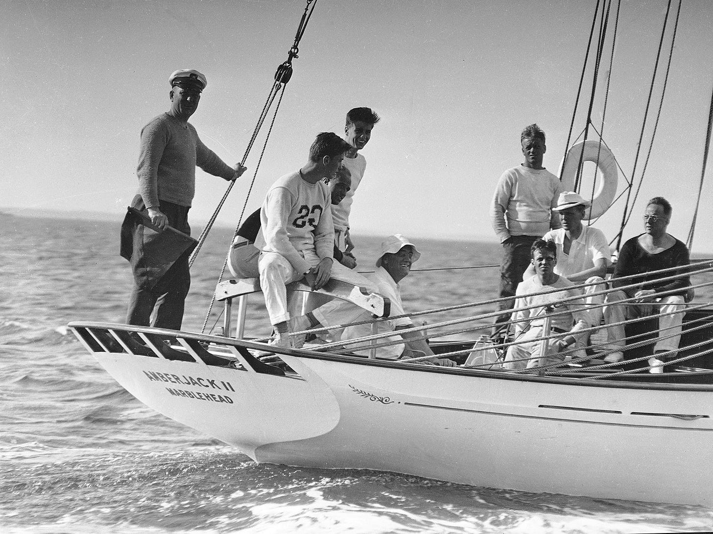 President Franklin D. Roosevelt, wearing a sailor's hat, sails aboard the 45-foot schooner Amberjack from Buzzard's Bay, Mass., toward Campobello Island during his vacation in June 1933.