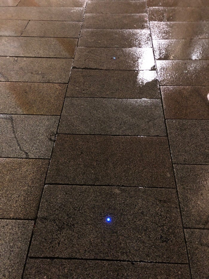 Pathway at night with dots of light Pathway at night with dots of light