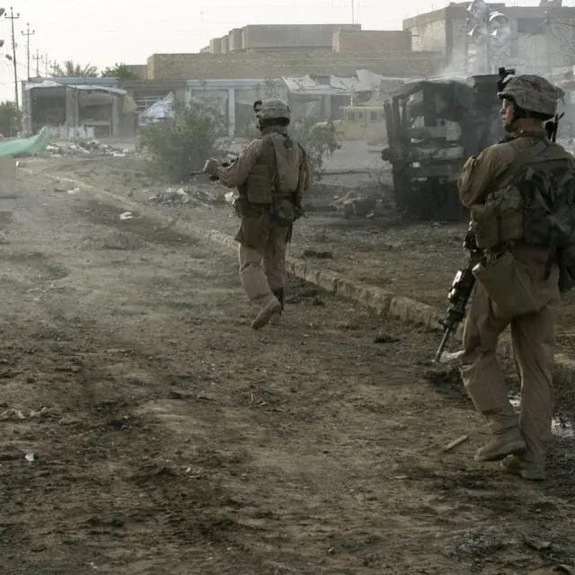 Marines with Fox Company, 2nd Battalion, 7th Marine Regiment, conduct a foot patrol on April 20, 2007, amidst the Iraqi landscape. Marines with Fox Company, 2nd Battalion, 7th Marine Regiment, conduct a foot patrol on April 20, 2007, amidst the Iraqi landscape.