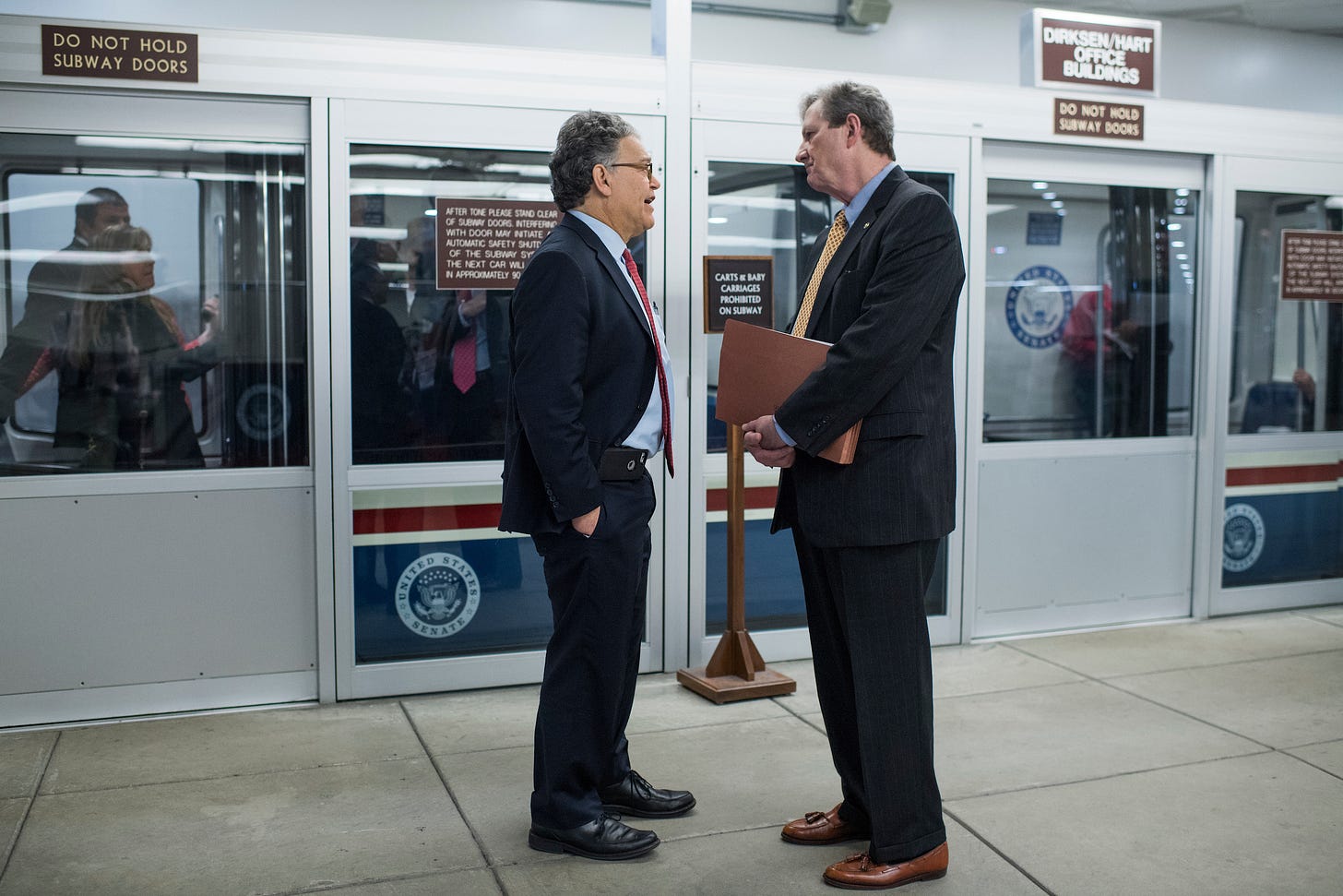 Sens. Al Franken, D-Minn., left, and John Kennedy, R-La., are seen in the Senate subway earlier this month. (Tom Williams/CQ Roll Call)
