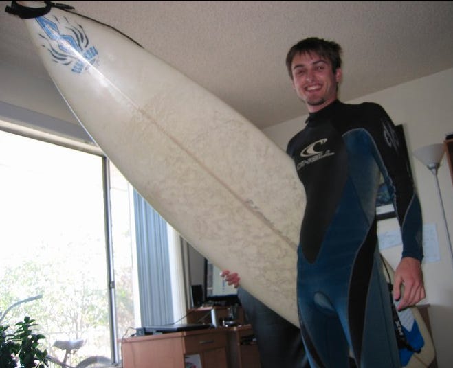 Ryan with his surfboard Ryan with his surfboard
