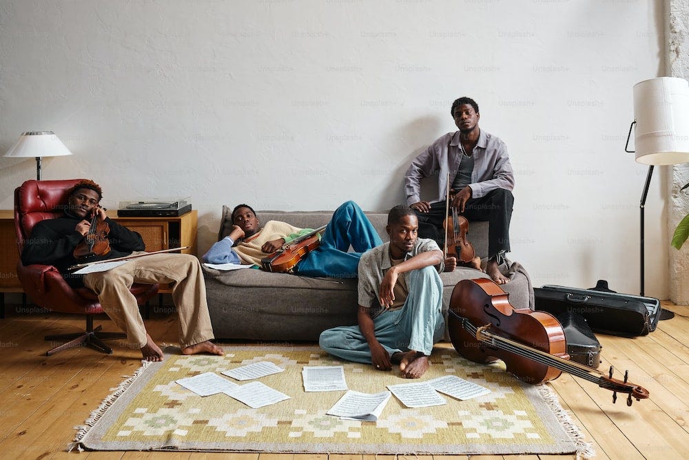 a group of people sitting on top of a couch