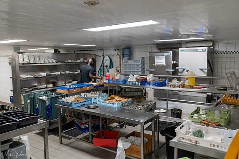 Inside the kitchen, including dishwasher