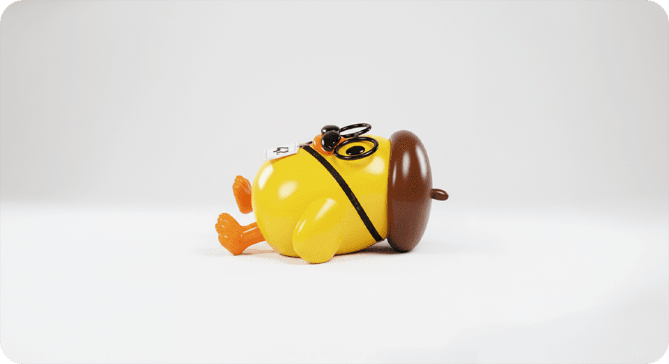 Yellow duck toy lying down.