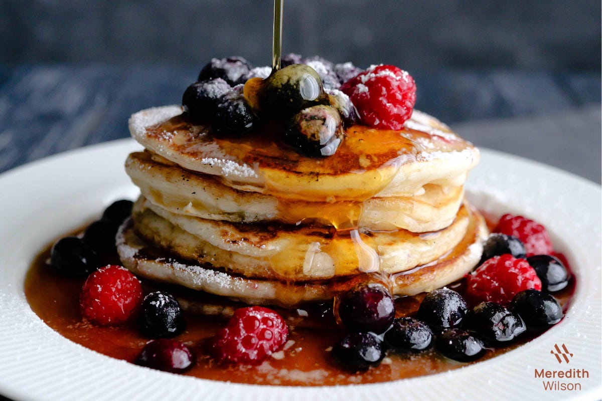 pancake stack with maple syrup and berries pancake stack with maple syrup and berries
