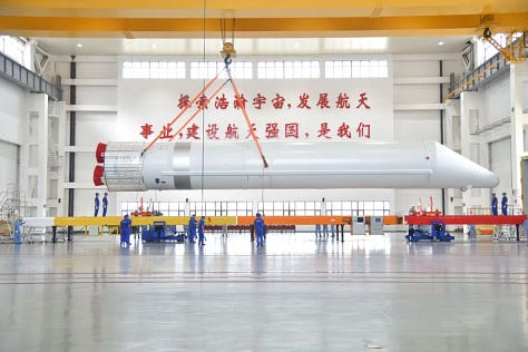 One of the Long March 5's boosters as well as the Y10 vehicle rolling out to and at Launch Complex 101.