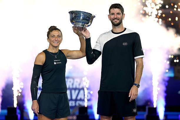 Sara Errani and Andrea Vavassori of Italy pose with their trophy after defeating Iga Swiatek of Poland and Casper Ruud of Norway during the Mixed...