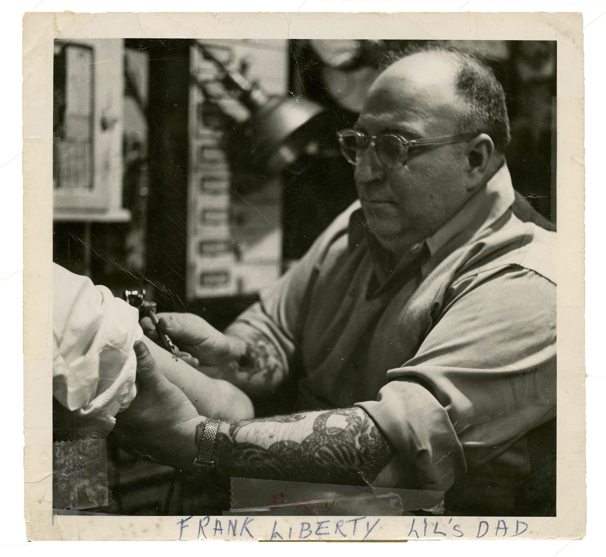 Proprietors hunched in shirtsleeves over buzzing machines, image size:2048x1881