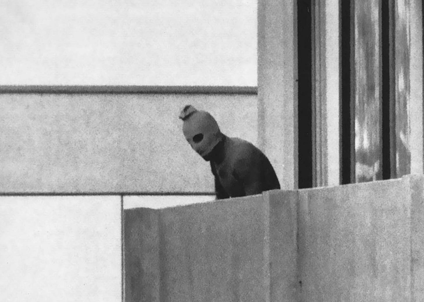 A haunting image from the Munich Massacre during the 1972 Olympic Games, a day of global tragedy.