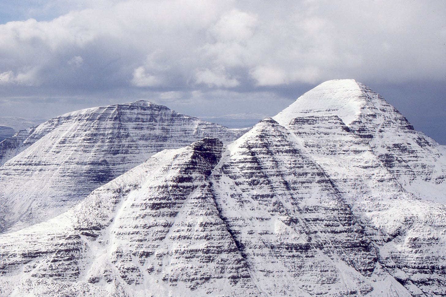 snow-covered rocky mountain