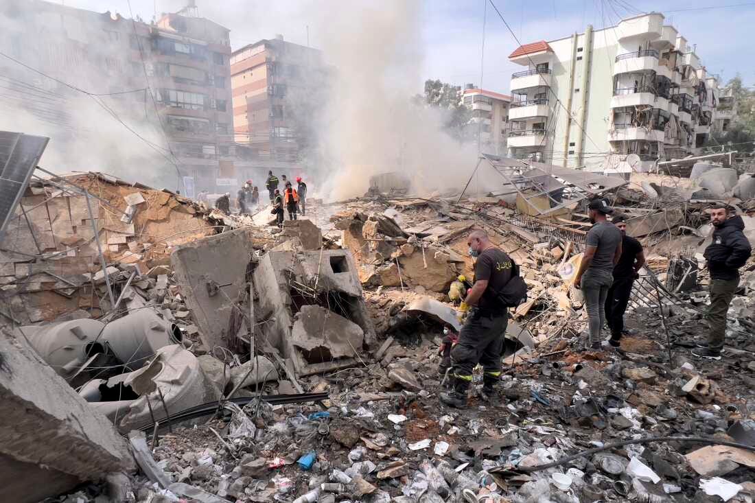 Firemen inspect the area after an Israeli army strike in the suburb of Dahiyeh, Lebanon, Friday. Firemen inspect the area after an Israeli army strike in the suburb of Dahiyeh, Lebanon, Friday.
