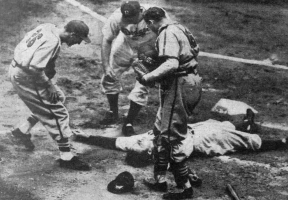 Photograph taken immediately after Joe Medwick's beaning, with players huddling around him.