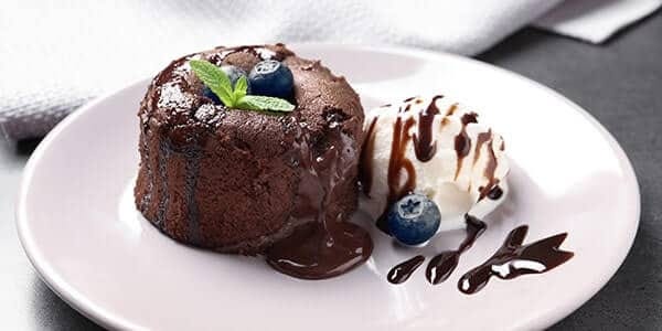 Delicate chocolate fondant with a scoop of ice cream Delicate chocolate fondant with a scoop of ice cream