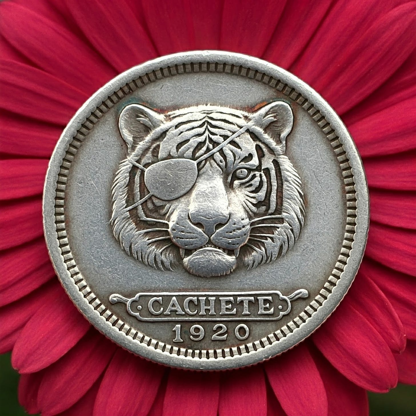 Blind Tiger silver token on red flower petal background.