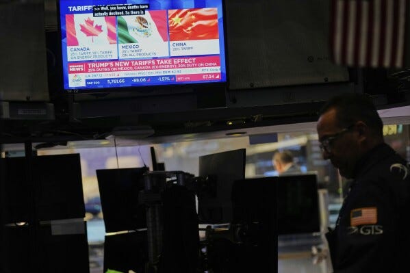 Financial news is displayed as Ppeople work on the floor at the New York Stock Exchange in New York, Tuesday, March 4, 2025. (AP Photo/Seth Wenig) Financial news is displayed as Ppeople work on the floor at the New York Stock Exchange in New York, Tuesday, March 4, 2025. (AP Photo/Seth Wenig)