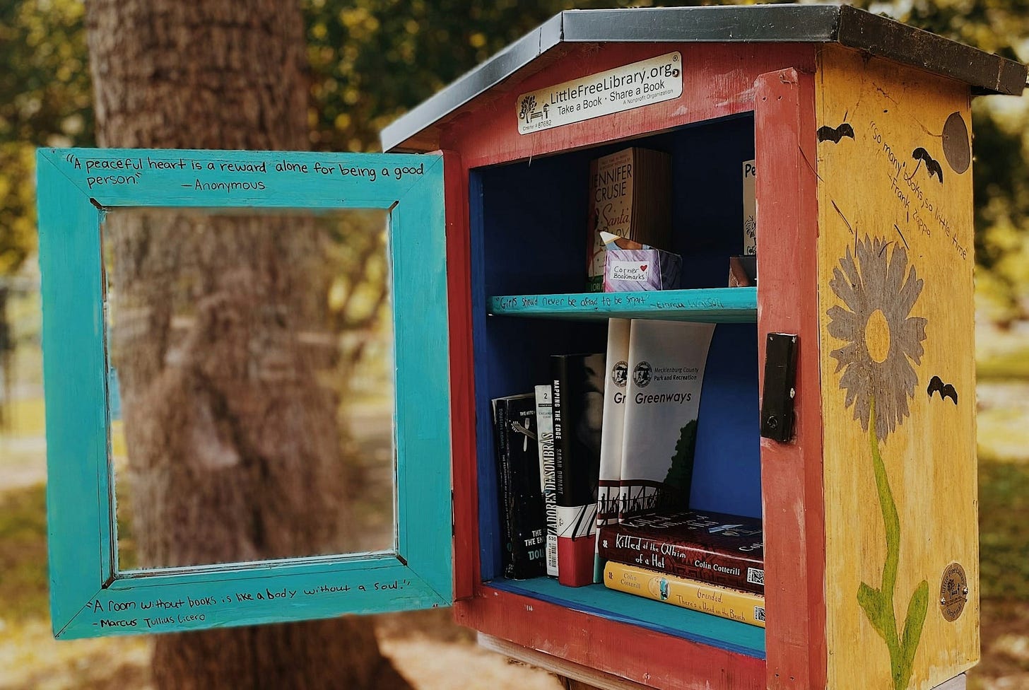 a small wooden birdhouse a small wooden birdhouse