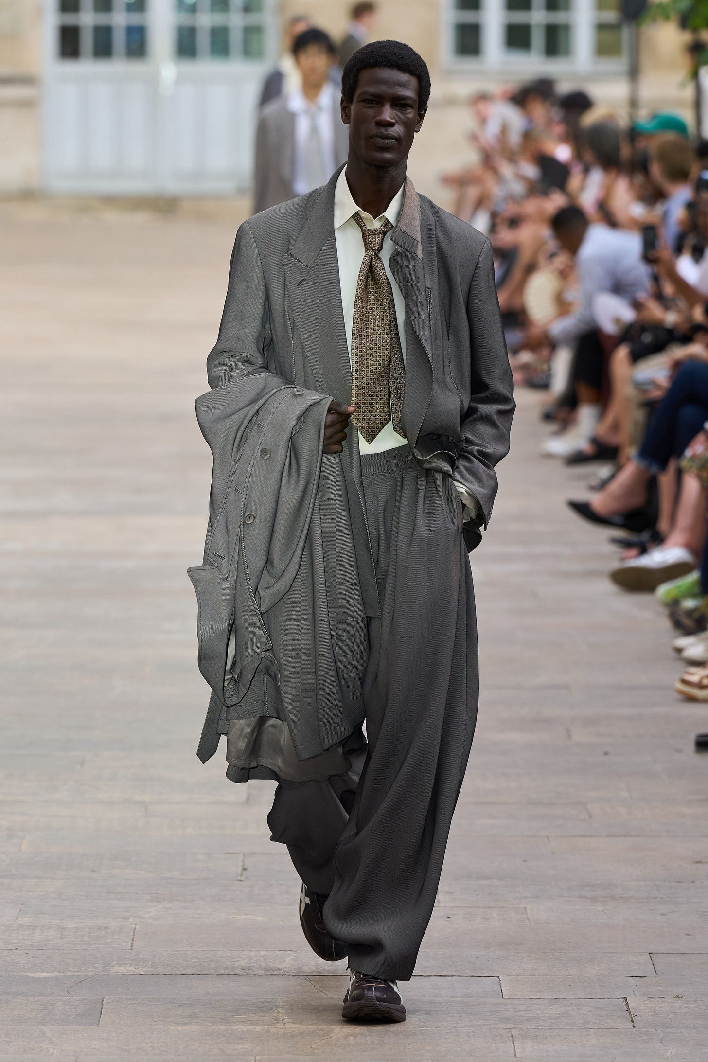 Image may contain Ron Killings Pedestrian Person Standing Adult Clothing Footwear Shoe Accessories and Formal Wear