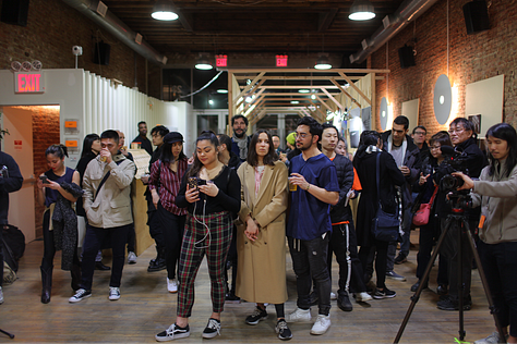 Attendees and artists at Ka Yee Chan's event, Hungry.
