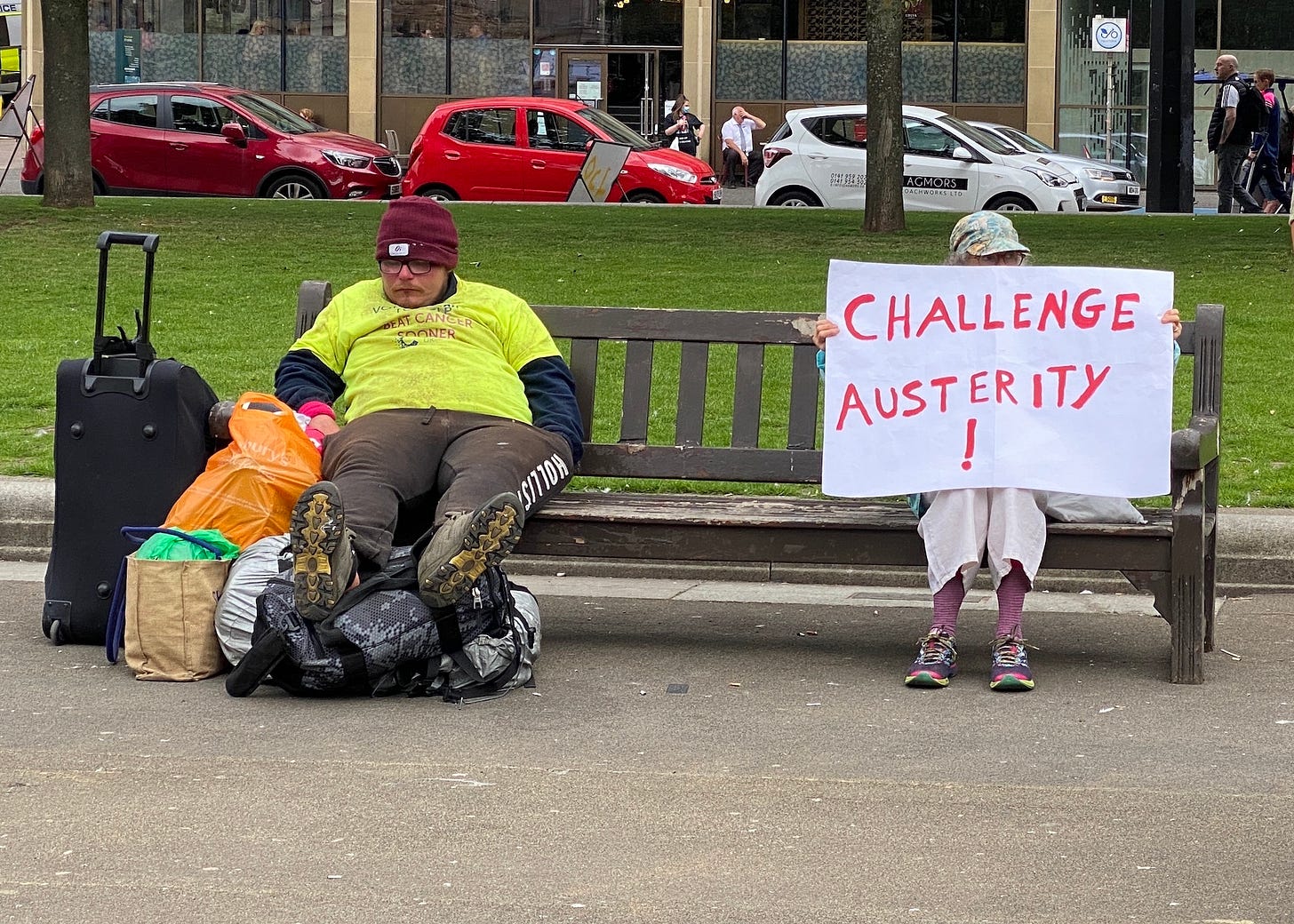 protester and homeless man