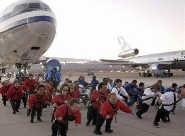 Little people pulling an airplane??? : r/WTF