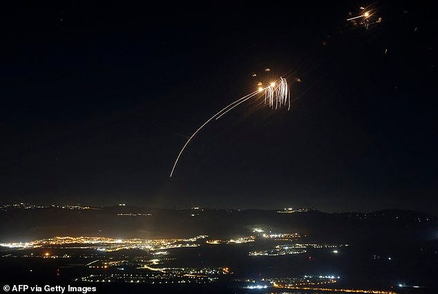 Two Israeli troops were wounded in the attack, which also set off a fire in northern Israel