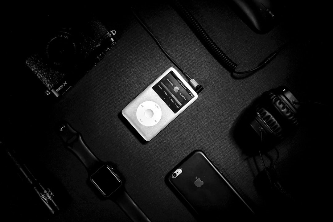 turned on iPod on black surface turned on iPod on black surface