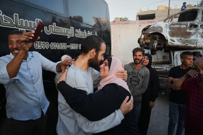 People greet freed Palestinian prisoners as they arrive in Gaza after their release from Israeli prison, outside Nasser Hospital in Khan Younis. People greet freed Palestinian prisoners as they arrive in Gaza after their release from Israeli prison, outside Nasser Hospital in Khan Younis.