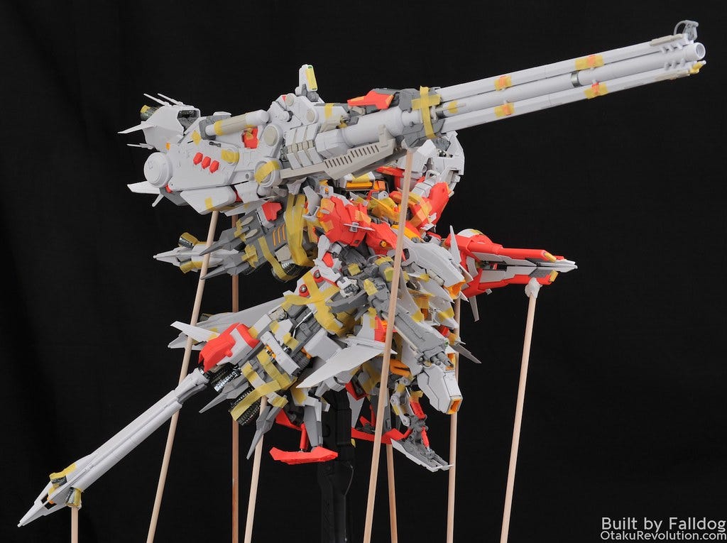 A work in progress shot of the Mechanicore Tief Sturmer model kit, a plastic robot monstrosity held together by sticks and tape.