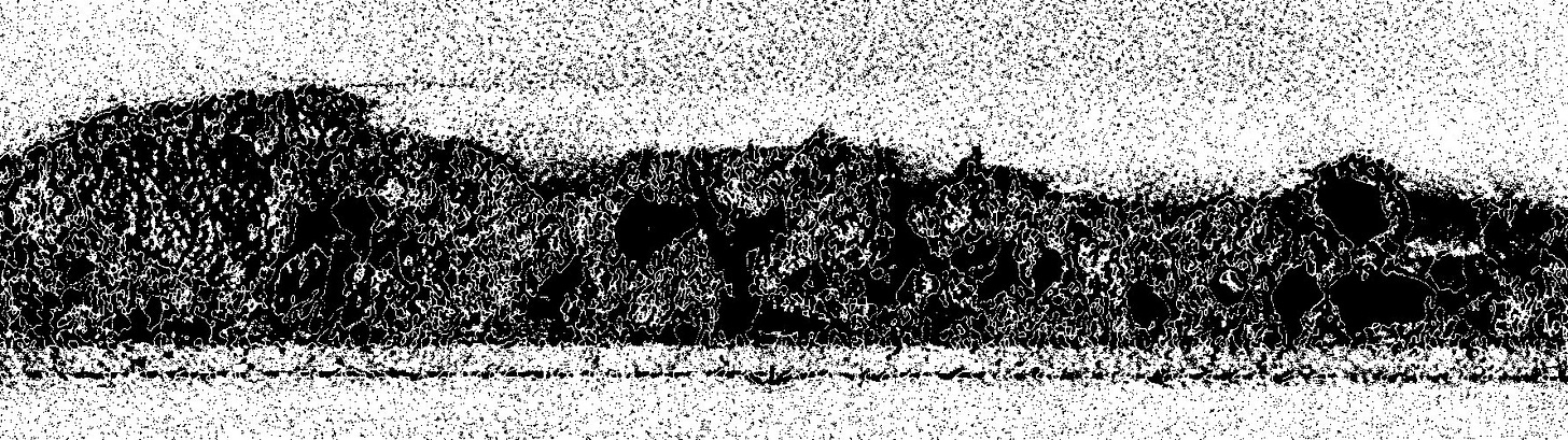Black and white image - white covers most of the area outside the sample, and most of the sample is black with some white features remaining selected inside. The white area is speckled with unselected dark pixels.