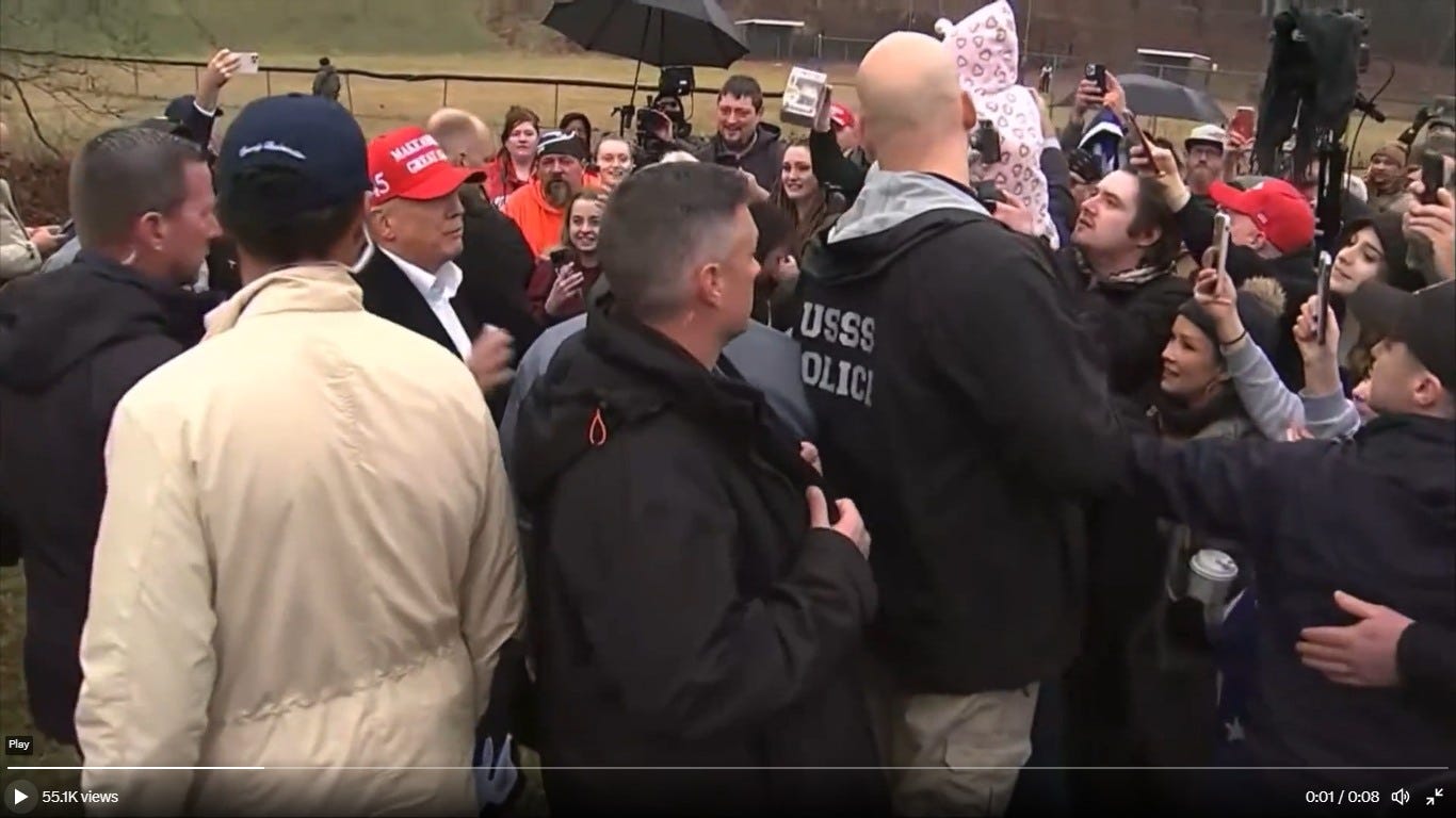 May be an image of 2 people and people standing