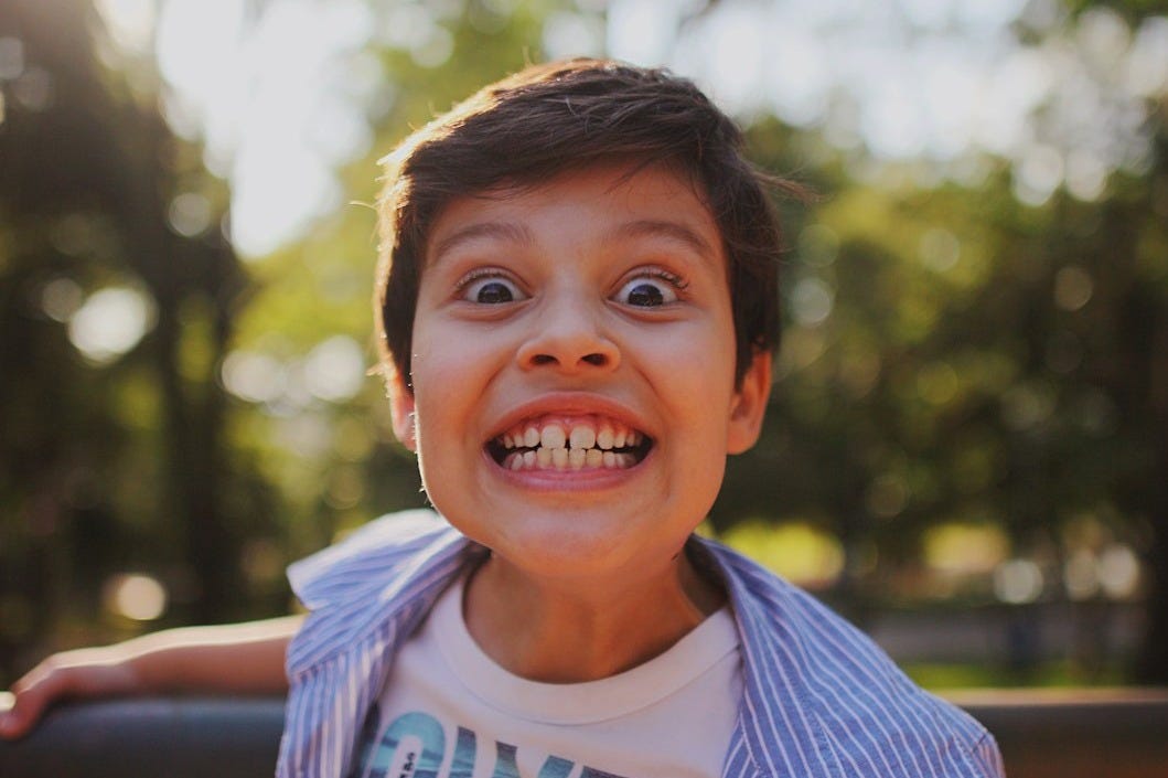 a boy smiling for the camera