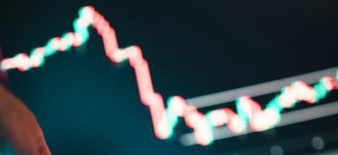 A person using a laptop computer on a desk