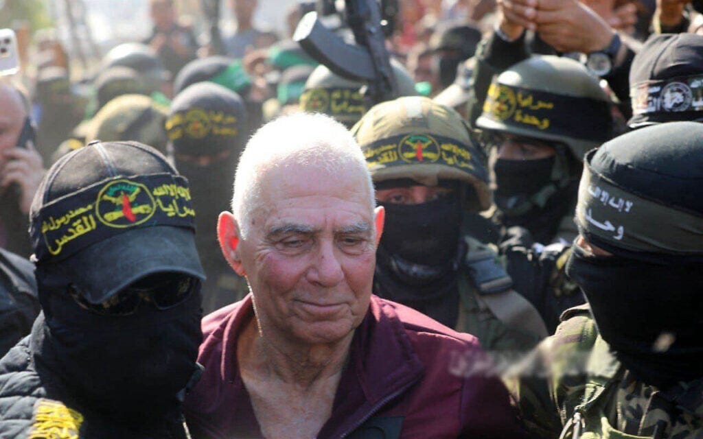 Gadi Mozes, 80, surrounded by gunmen during his release from captivity in Khan Younis, Gaza, January 30, 2025 (Via social media) Gadi Mozes, 80, surrounded by gunmen during his release from captivity in Khan Younis, Gaza, January 30, 2025 (Via social media)