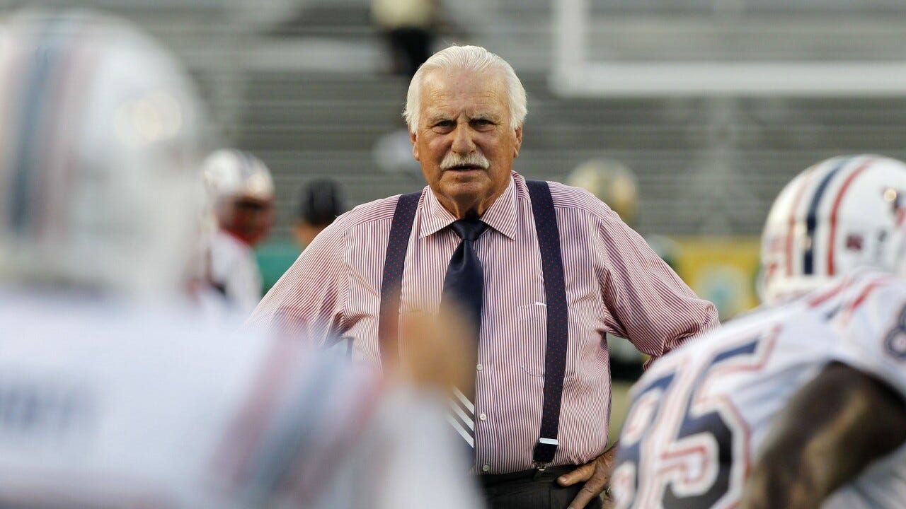 FAU Owls head coach Howard Schnellenberger looks at team before game in 2010