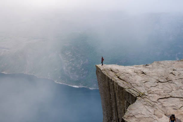 4,800+ Standing On Edge Of Cliff Stock Photos, Pictures & Royalty-Free  Images - iStock | Chasm, Cliff edge, Lightning