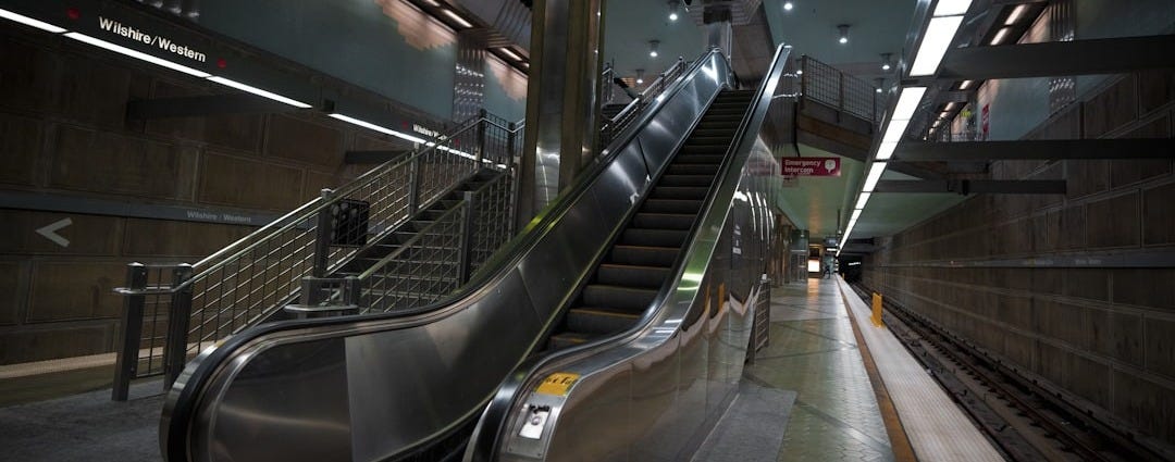 An escalator in a subway station at night