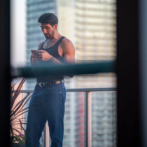 Candid street-style photograph capturing a person’s outfit in an urban setting, highlighting natural textures, layered clothing, and understated personal style as observed in everyday city life.