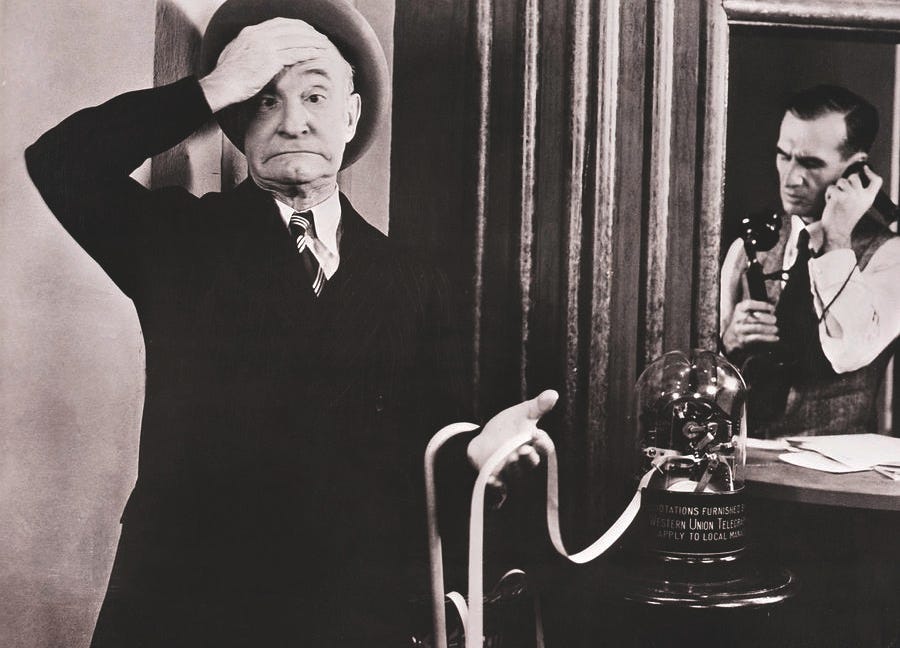 Charles Murray Reading Ticker-tape Photograph by Bettmann - Fine Art America