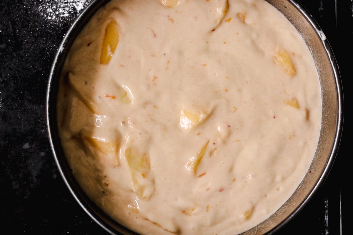 overhead image of apple cake in a pan.