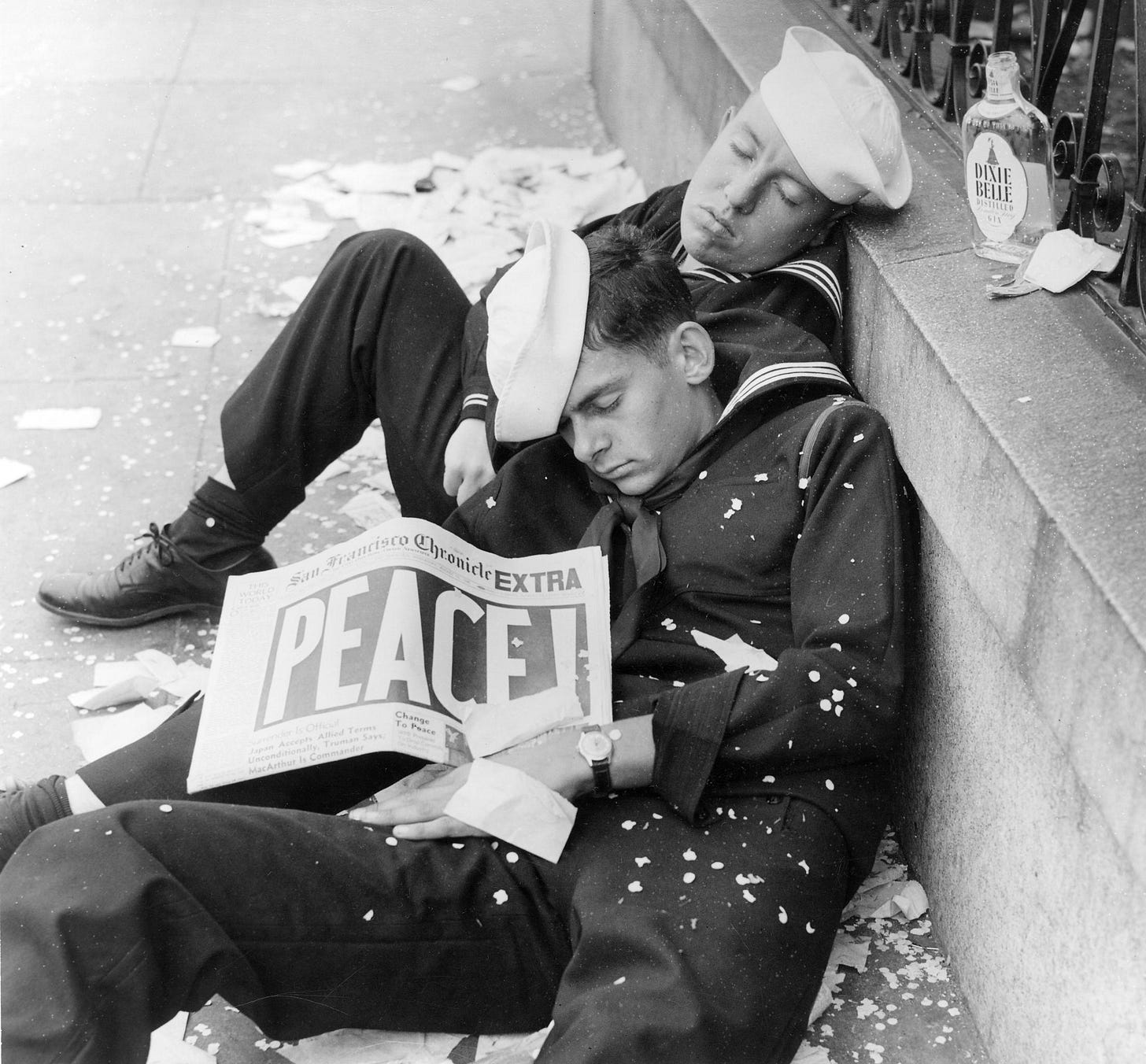 Two sailors asleep on a San Francisco street after celebrating Victory over Japan, August 15, 1945. Two sailors asleep on a San Francisco street after celebrating Victory over Japan, August 15, 1945.