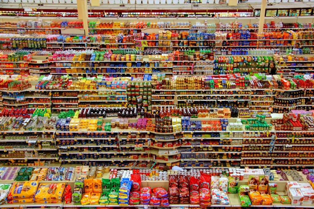 Supermarket shelves stocked with various products. Supermarket shelves stocked with various products.