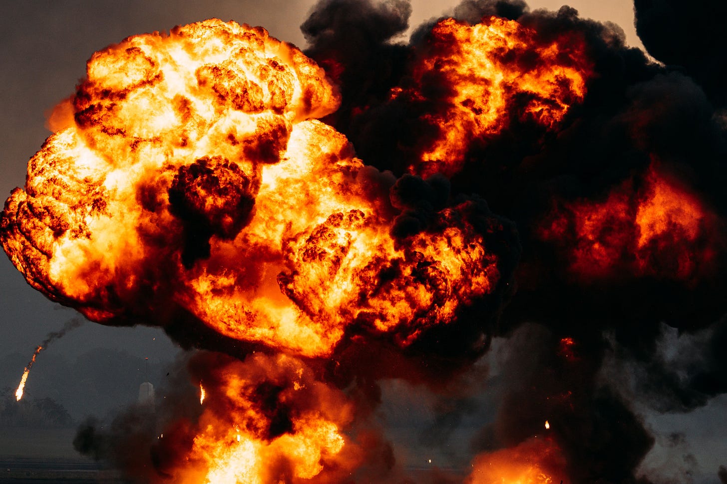 An image showing a fiery explosion with dark billowing smoke
