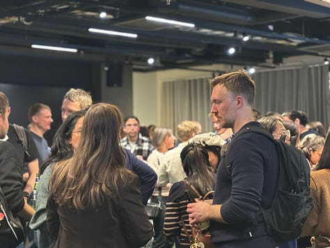 Participants networking, listening to talks, and discussing agents and data engineering during a community night at Google.