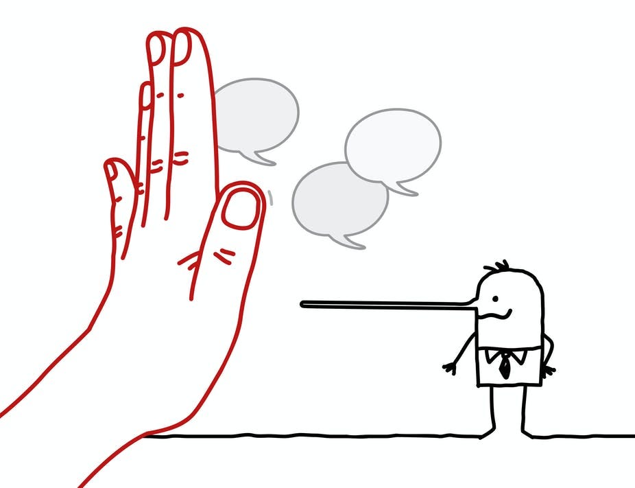 A hand stopping a Pinocchio-nosed person A hand stopping a Pinocchio-nosed person