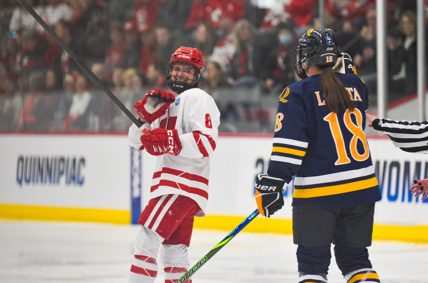 Wisconsin women's hockey forward Hannah Halverson waves to Quinnipiac captain Mia Lopata Wisconsin women's hockey forward Hannah Halverson waves to Quinnipiac captain Mia Lopata